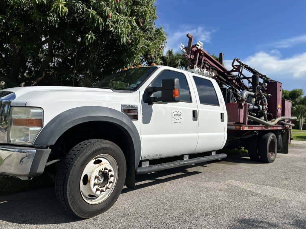 Brent Pump Works service truck with drilling rig